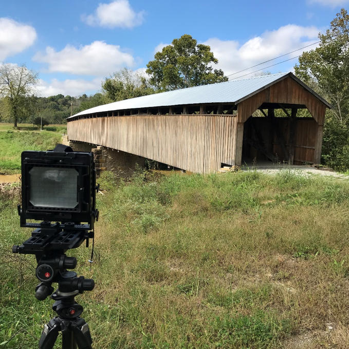 Fig. 1 Large format 4x5” camera in front of the ca. 1865 Beech Fork Bridge, which was rehabilitated in 2016-2017. Photo courtesy of author.
